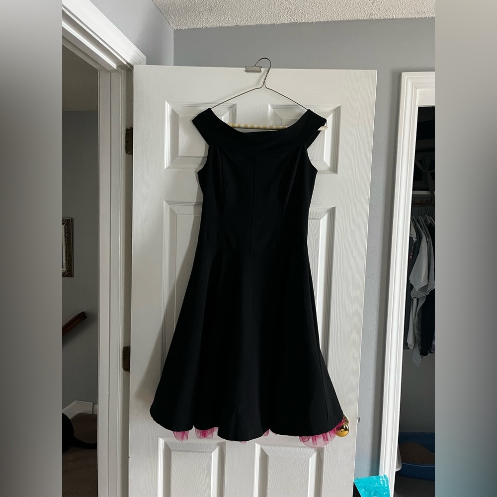 Black dress with pink frill.